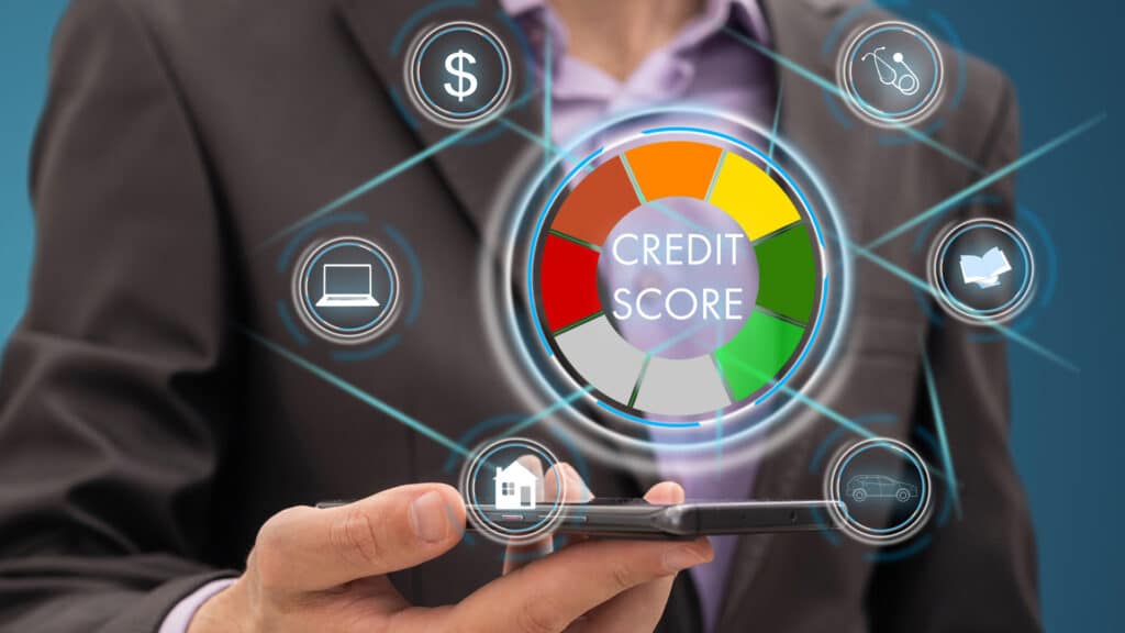 Credit score monitoring icons above a cell phone