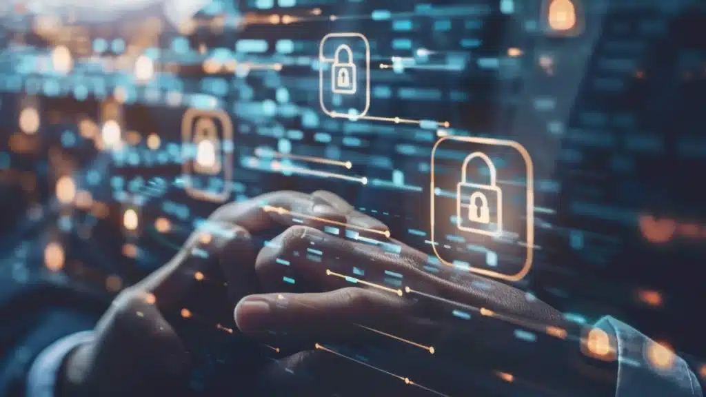 Close-up of a person's hands resting together over a digital screen filled with glowing padlock icons and binary code, symbolizing cybersecurity and data protection.